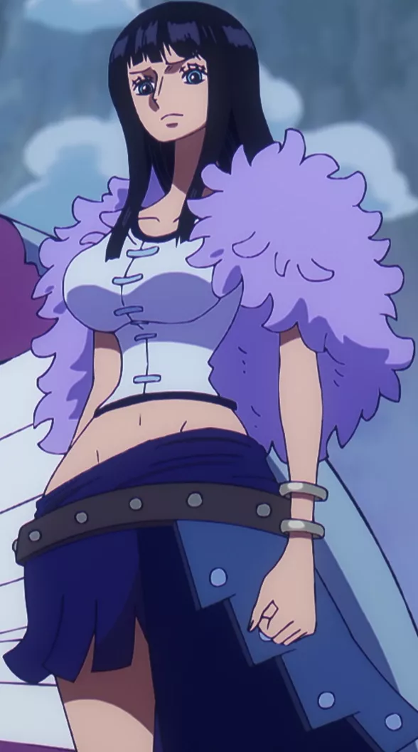Portrait of a tall dark-haired woman with a calm smile, arms crossed in a pose that suggests duplicated hands